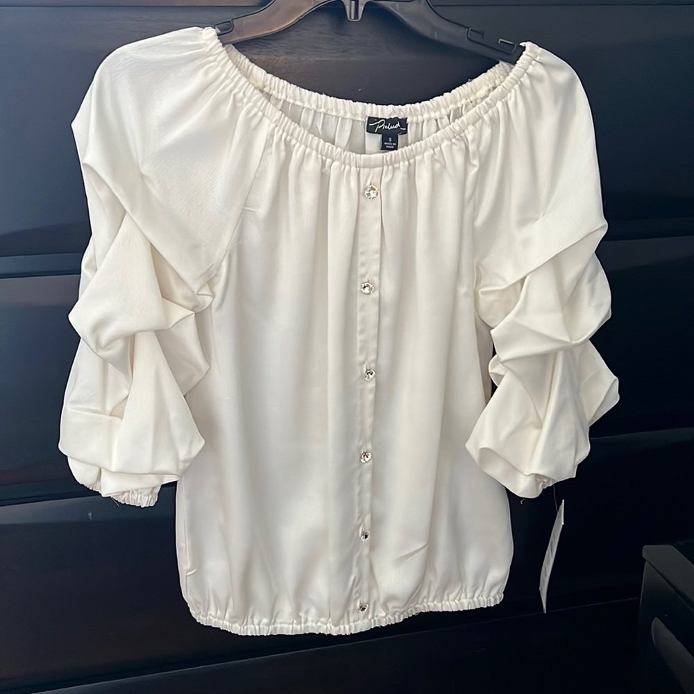 Dressy Blouse with bolero sleeves and rhinestone faux buttons.